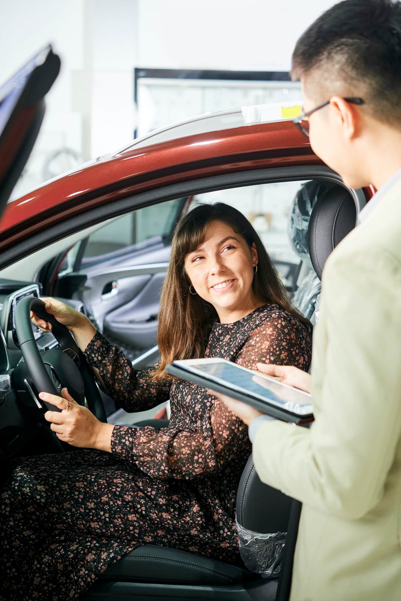 woman-and-salesman-in-car-showroom-1.jpg